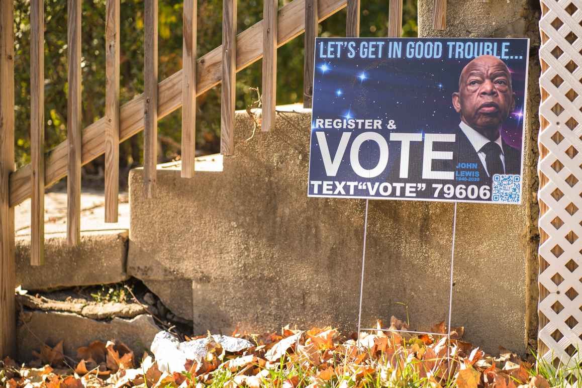 Yard sign showing Rep. John Lewis and encouraging people to vote